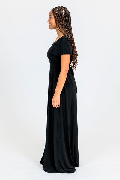 school music band student girl wearing black dress side view looking left