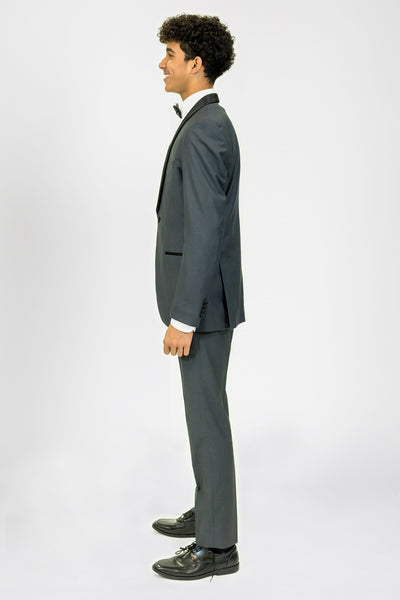 high school student boy wearing charcoal tuxedo black bow tie side view facing left