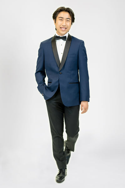 high school student boy wearing navy blue tuxedo black bow tie walking facing frontward