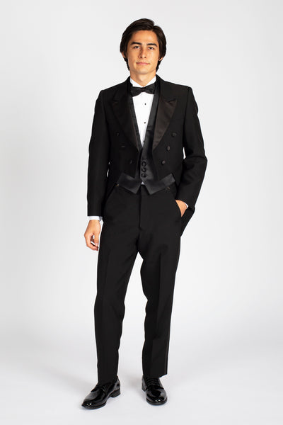 high school music band orchestra student boy wearing black tuxedo tailcoat black bow tie standing facing frontward