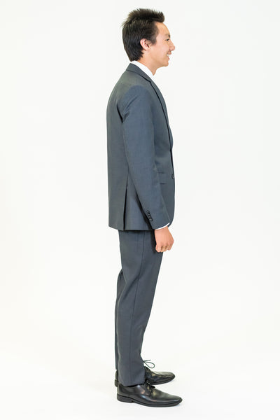 high school student boy wearing charcoal grey suit black tie side view facing right