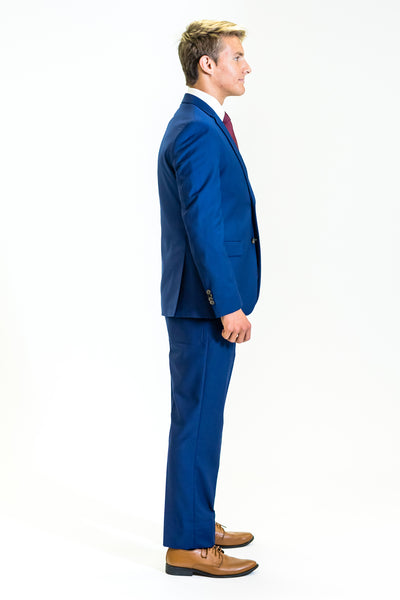 high school student boy wearing cobalt blue suit red tie side view facing right
