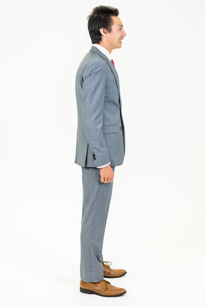 high school student boy wearing grey suit red tie side view facing right