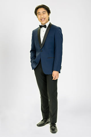 high school student boy wearing navy blue tuxedo black bow tie standing looking frontward
