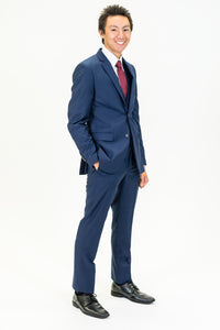 high school student boy wearing navy suit red bow tie standing