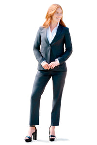 woman wearing charcoal suit pants white collar shirt standing